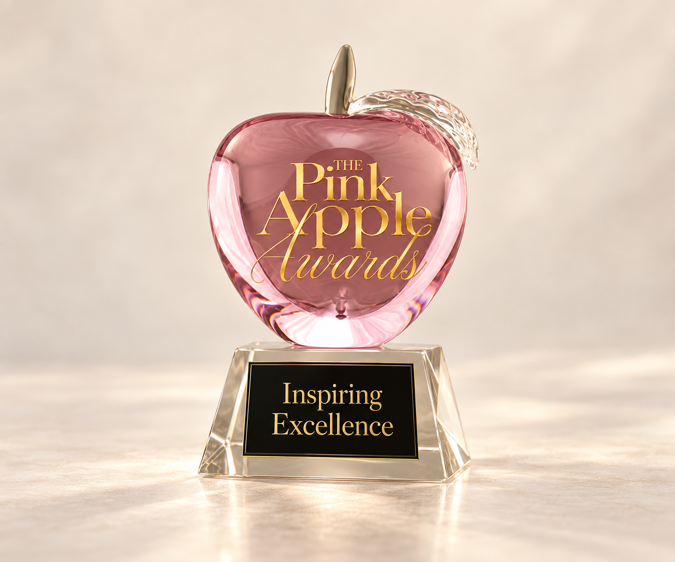 Pink Apple Awards crystal apple with Inspiring Excellence inscription